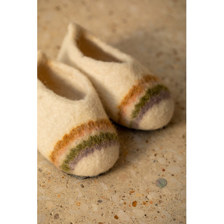 a rainbow drawn on felt slippers for children brings poetry and softness