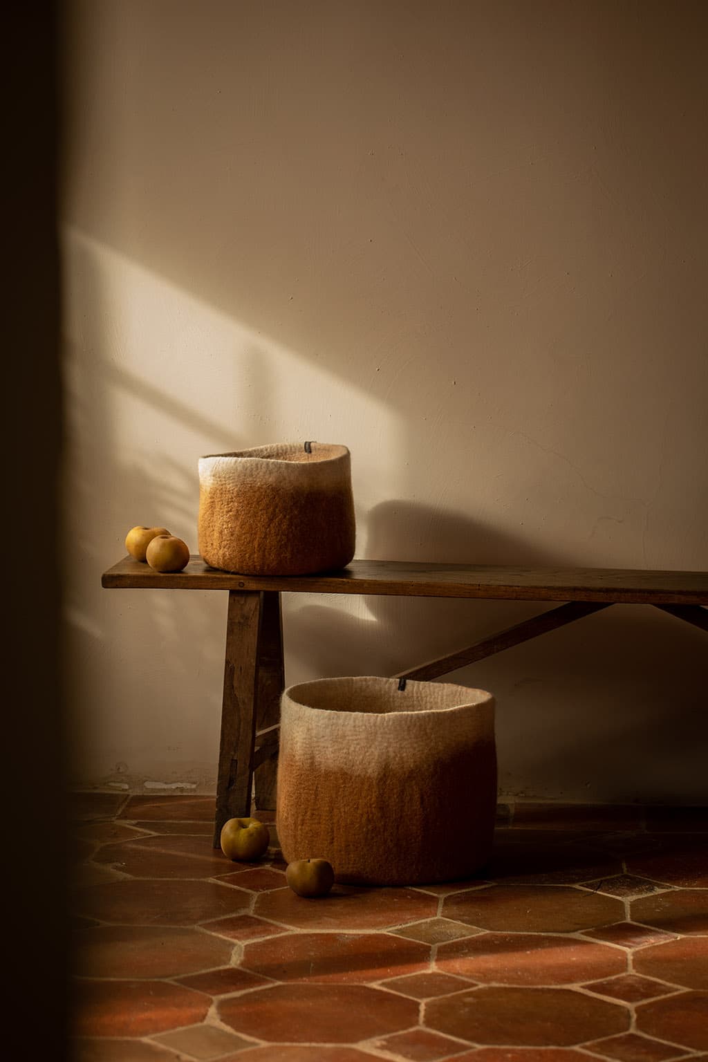 Duo of two-tone felted wool storage baskets