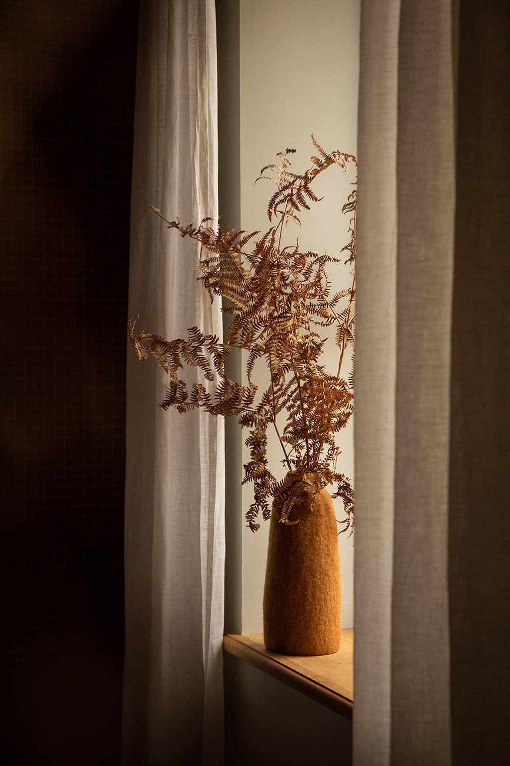 Orange wool felt vase cover for a natural decor