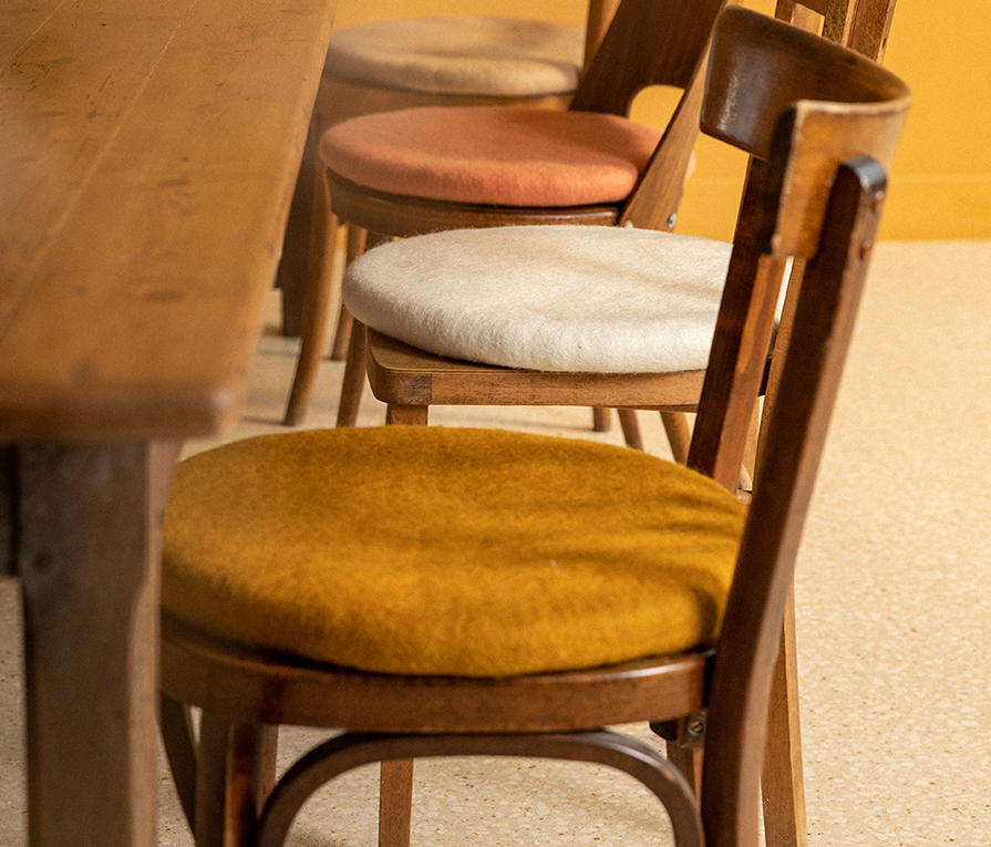 woolen felt cushion Chakati on wooden chairs
