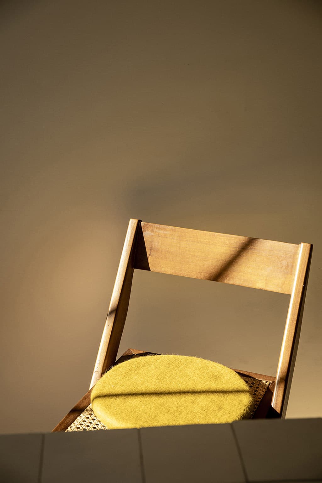 Green round chair cushion in wool felt