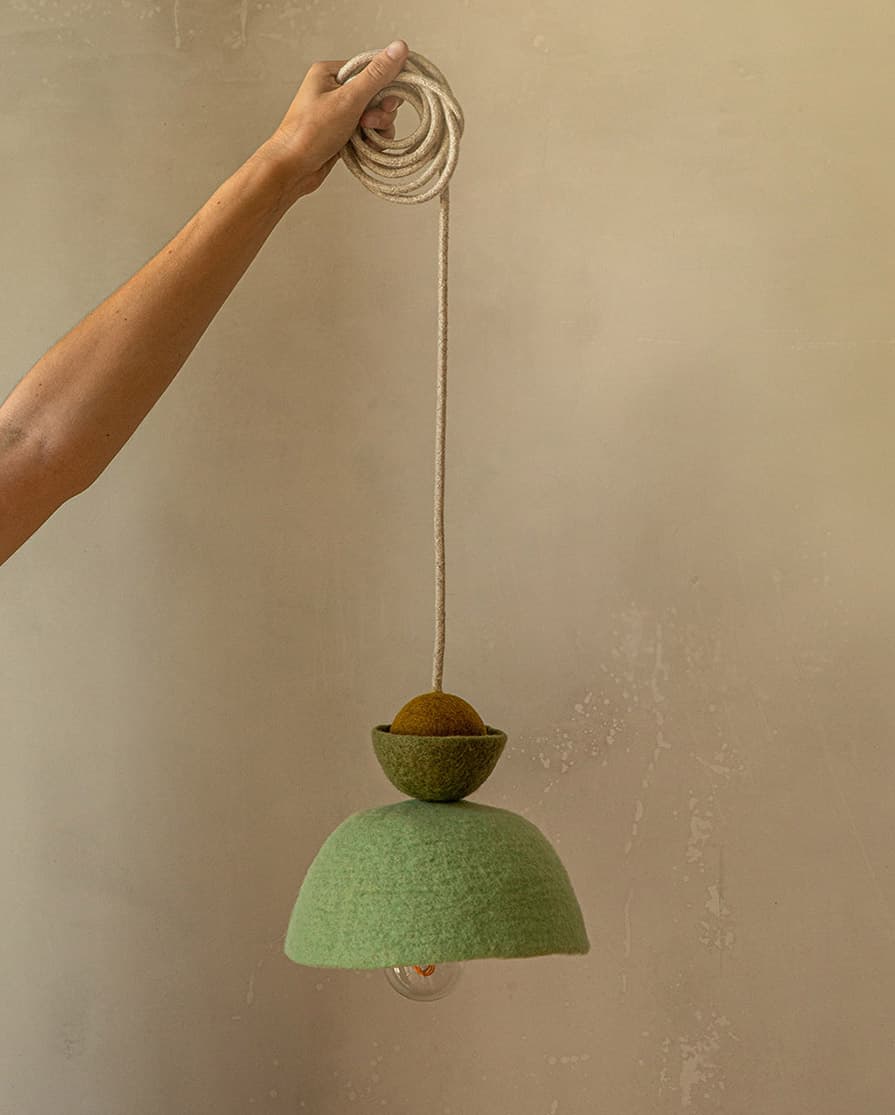 Graphic mint green pendant light made of felted wool
