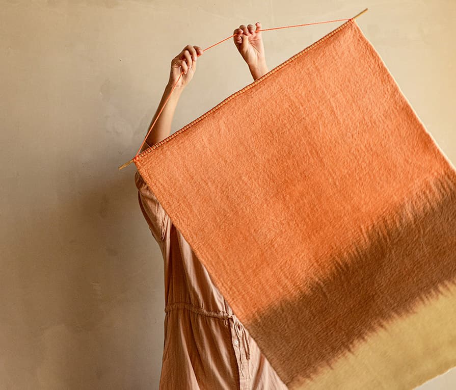 Wool wall hanging in shades of pink to decorate a wall
